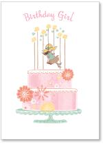 Girl on a swing on a cake