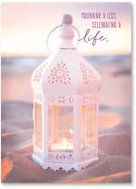 white lantern on beach