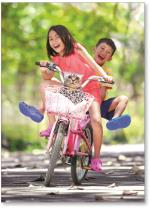 Girl and boy riding bike