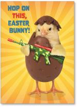 Chick in chocolate egg ready to fight